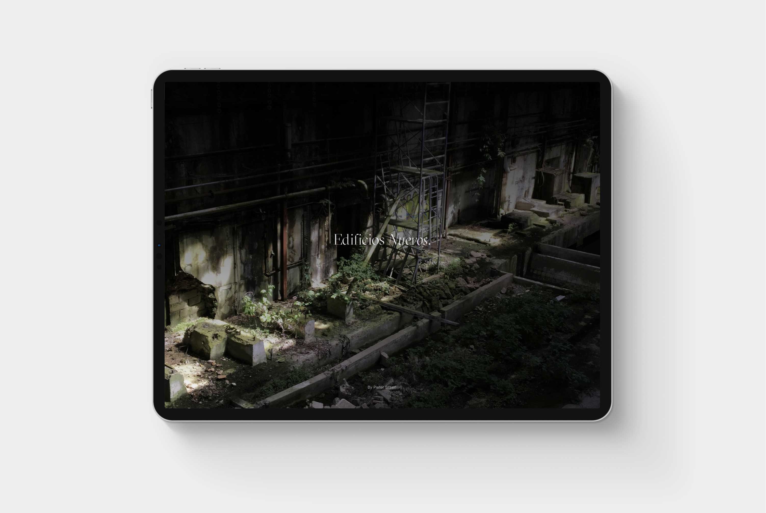 A tablet on a grey background showing the Edificios Nuevos design